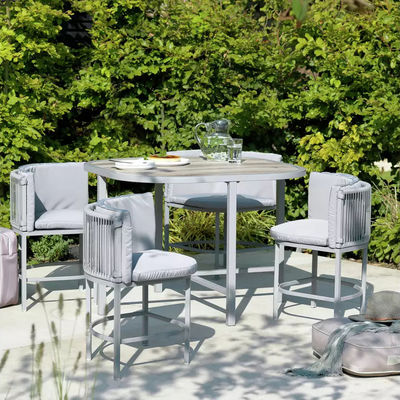 Maximize Your Outdoor Space with this Space Saving Rattan Weave and Steel Dining Set
