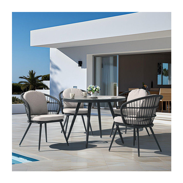 Courtyard Outdoor Dining Set with Round Tempered Glass Table and Rope Weave Armchair